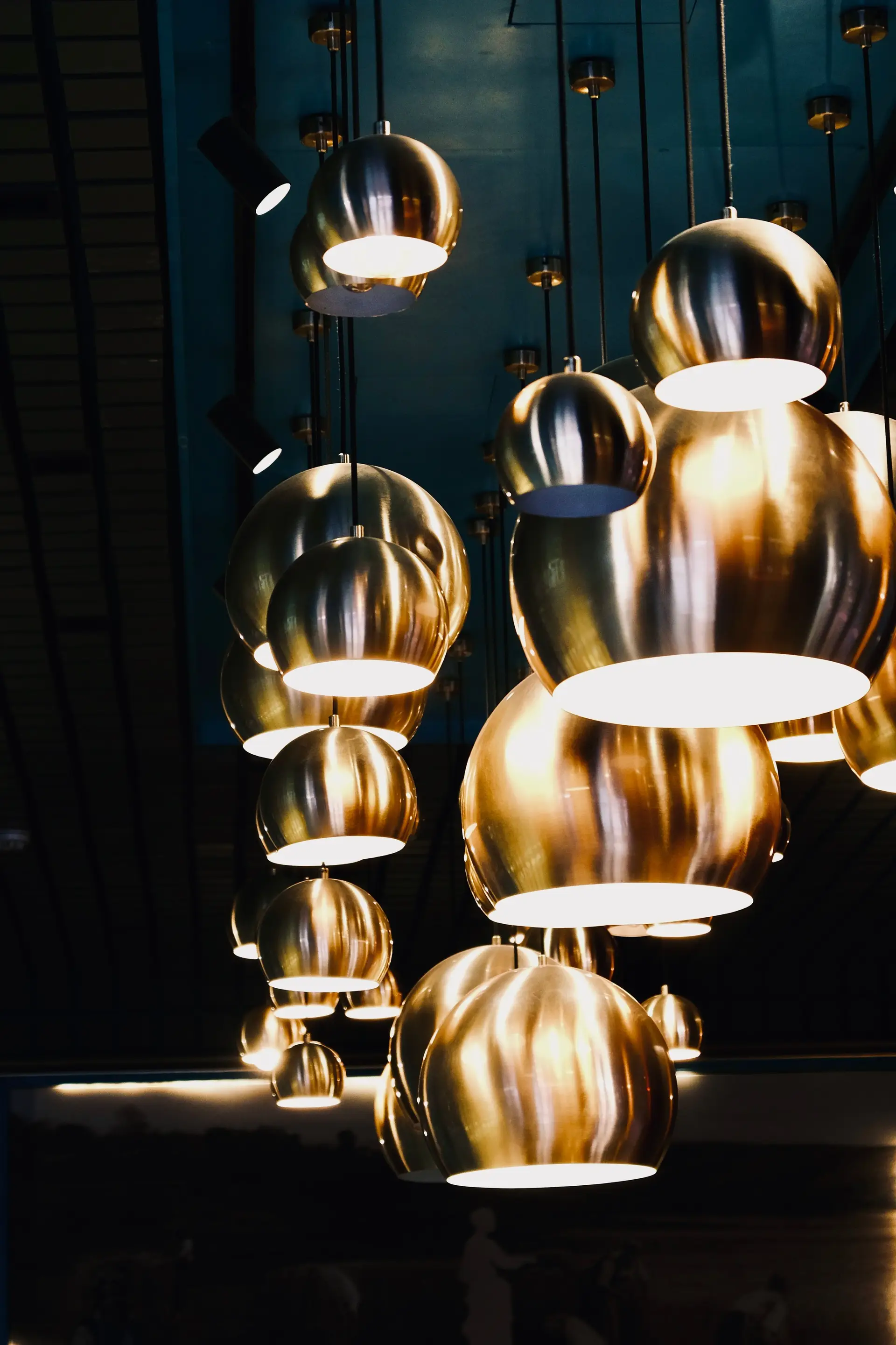 Sculptural pendant lighting in contemporary dining pavilion