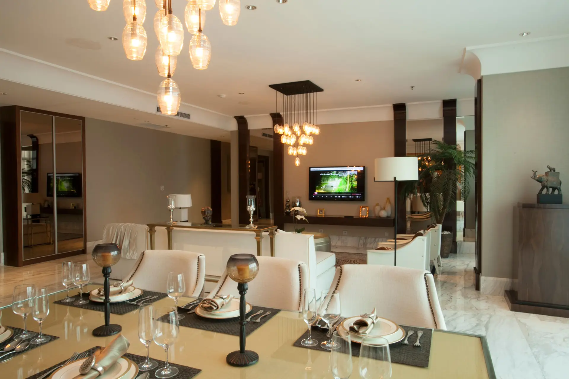 Subtle architectural downlighting over curated dining space