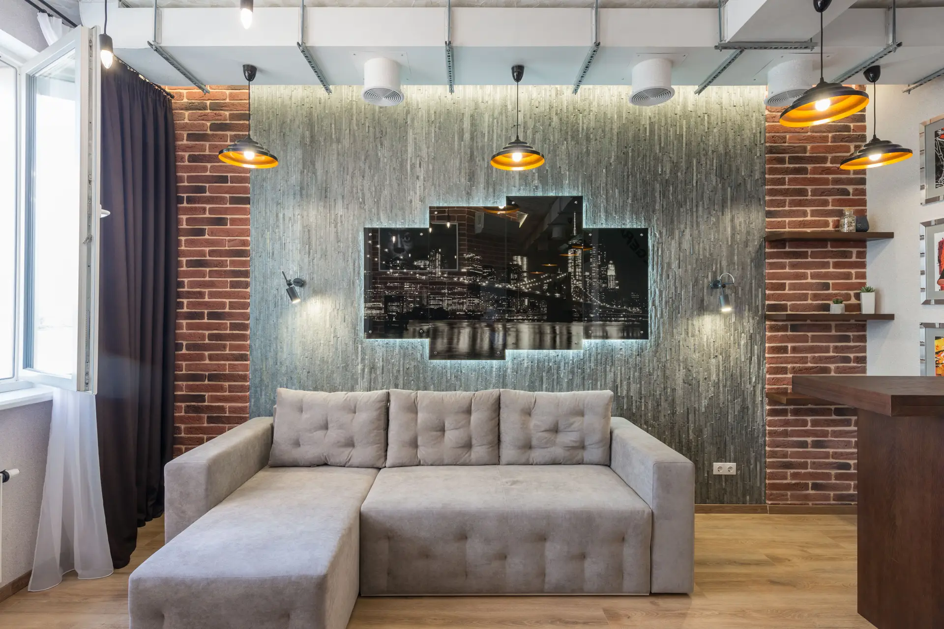 Exposed brick room with sculptural ambient chandelier