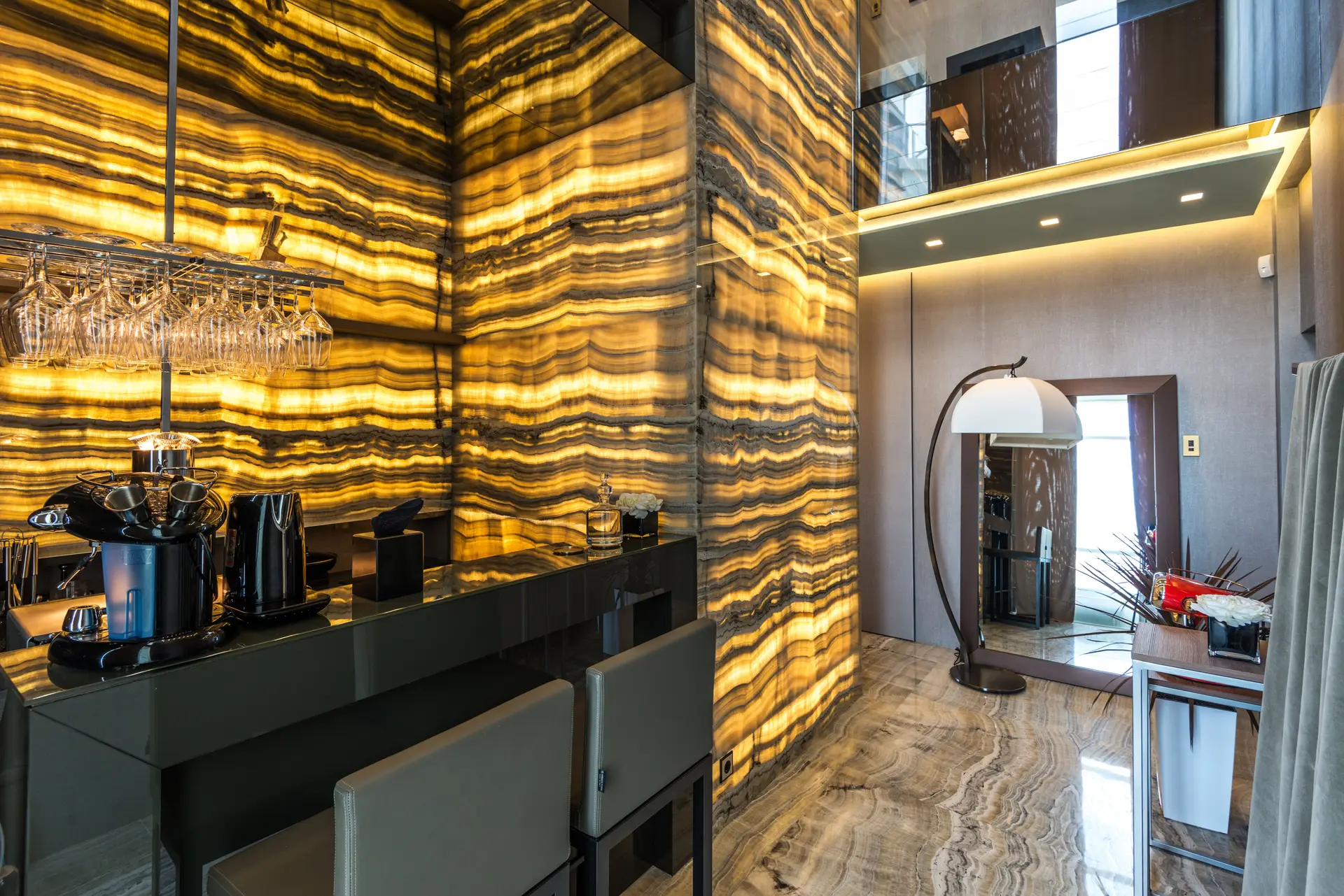Curated living lounge with ambient architectural cove lighting