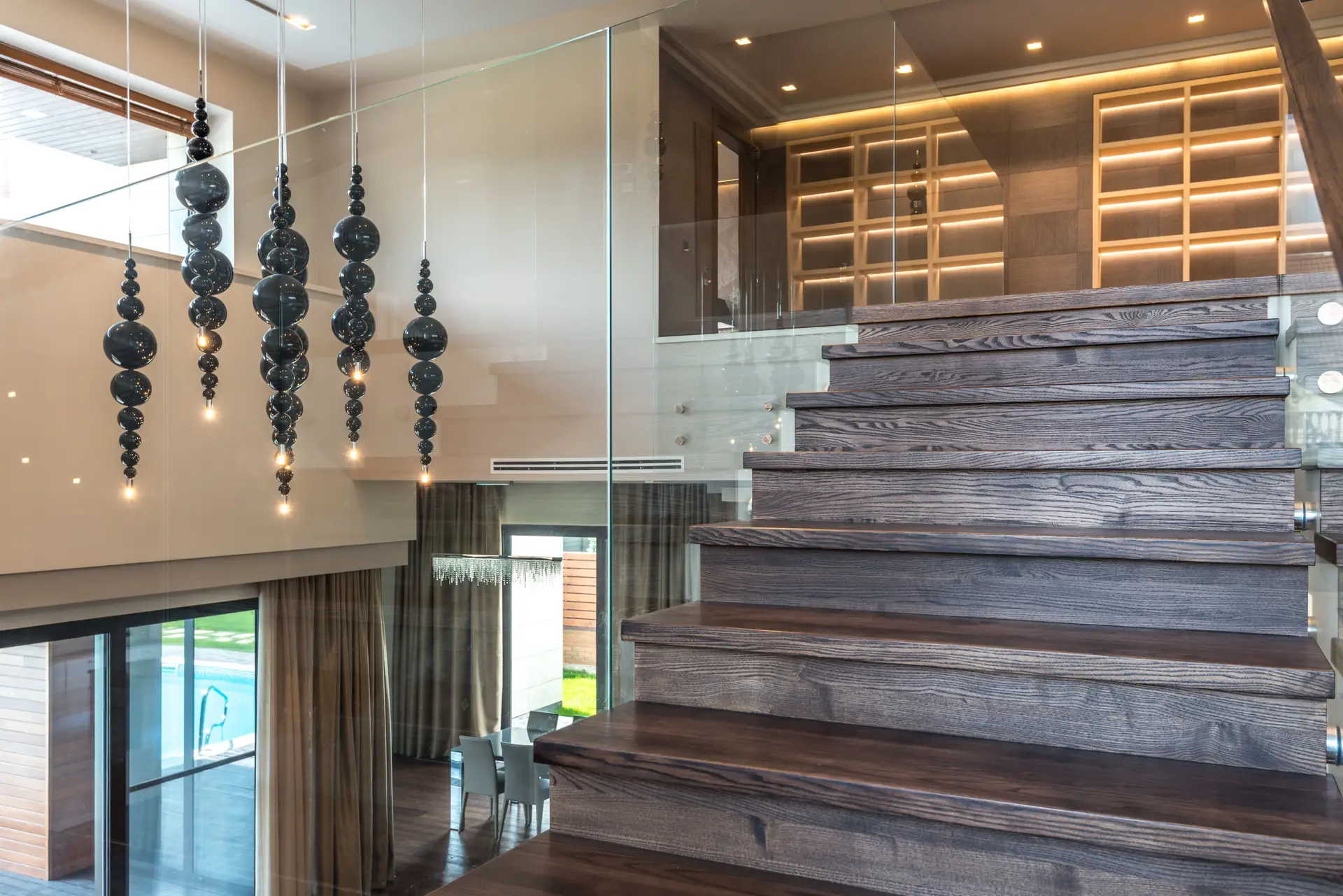 Architectural residential stairwell illuminated with subtle concealed lighting