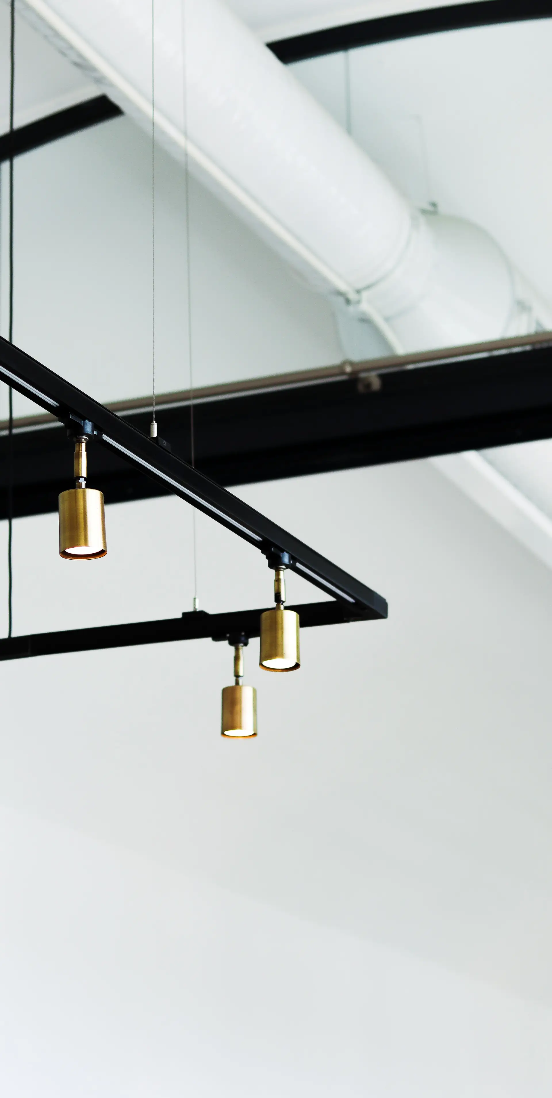 Brushed brass architectural pendant detail